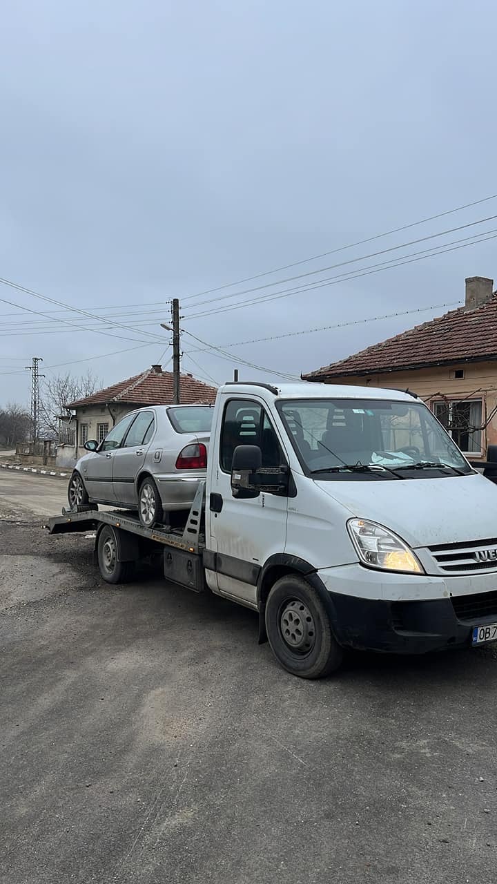 Tow truck carrying a car